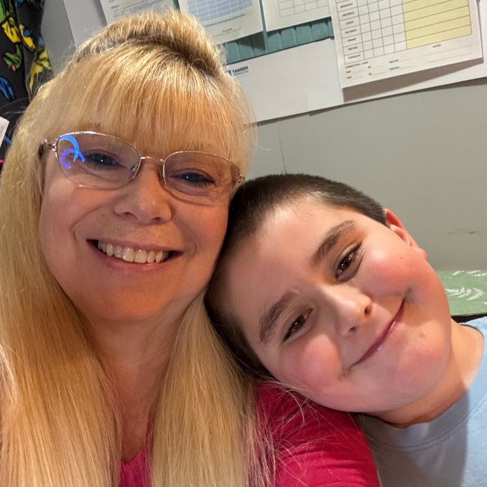 Heidi and her grandson Bentley smiling together